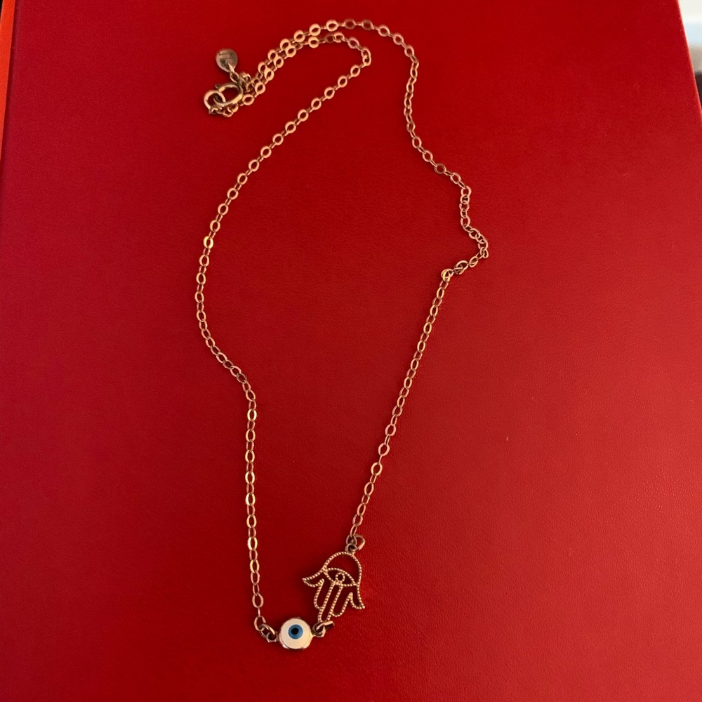 Gold hamsa hand with blue evil eye choker necklace